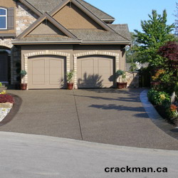 The Crackman custom tints your concrete driveway
